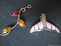 Front view of both sterling pendants showing stones and designs