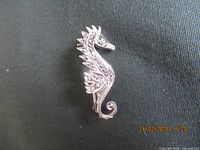 Front view of sterling seahorse brooch
