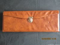 Closed brown case exterior with clasp