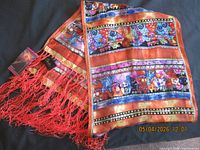 Full view of colorful cat motif silk scarf with fringe