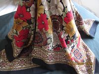 Full view showing floral pattern and border of scarf
