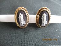 front view of pair showing cameos and gold rope frames