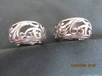 Front view of pair showing scroll filigree design