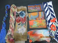 Group shot of all nine scarves