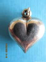 Front view of sterling silver puffy heart pendant