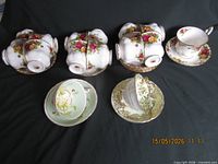 Stacks of Royal Albert Old Country Roses cups on matching saucers