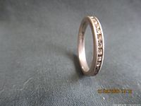 Ring standing on edge showing channel-set stones