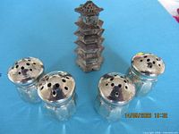 Group shot of pagoda shaker and four glass shakers