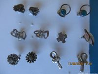 Overview of all 12 sterling silver stud earrings on display board