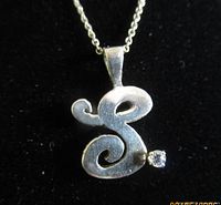 Front view of sterling S pendant with stone on chain