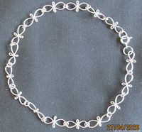 Full view of sterling silver link bracelet in circular form