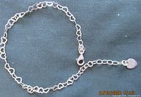 Full view of bracelet showing heart links and extender