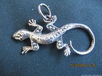 front view of sterling silver lizard pendant