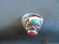Front view showing both cabochon stones and silver detailing
