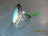 Side profile of ring showing bezel and split shank