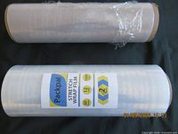 Two rolls of clear stretch wrap film, one with label, one partially used