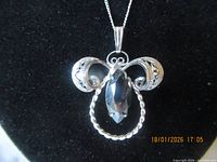 front view of sterling pendant and chain on bust