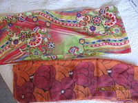 Both scarves laid out showing full patterns