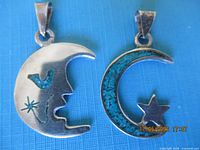 Front view of both sterling silver pendants