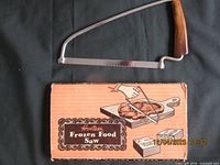 Front of frozen food saw displayed above original box showing product name and illustration