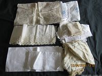Overview of assorted vintage linens laid out