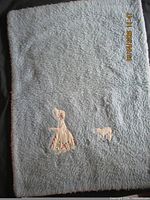 Full view blue side showing appliqué