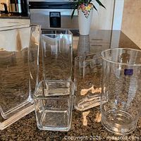 Front view of all five vases displaying shapes and Casa di Vetro label