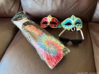 Full lot showing packaged wig, two masks, sunglasses