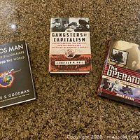 Front covers of all three books visible