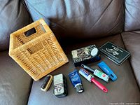 Overall view: wicker box, tins, tubes, brush, lint roller