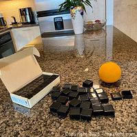 Open carton showing multiple display boxes and loose boxes on countertop