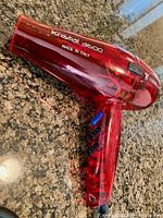 Left-side view showing Kristal 3600 branding and transparent red housing