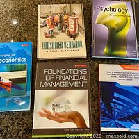 Front covers of the five textbooks displayed on countertop