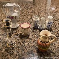 Group shot of all seven miniature decorative items on countertop.