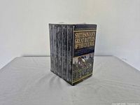 Sealed VHS box set standing showing spine edges of six tapes