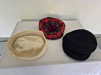 All three caps arranged on table