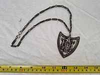 Full view of necklace with measuring tape showing length