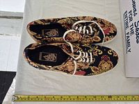Top view of both shoes showing paisley print, laces, insoles
