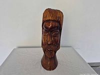 Front view of wooden carved head bust
