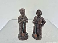 Front view of both miner figurines