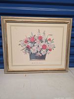 Front view showing floral print, matting and gilded wood frame