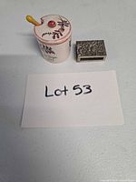 Mustard jar with lid and spoon alongside sterling silver matchbox cover