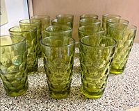 Front view of all 14 green thumbprint tumblers