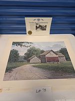Full view of matted print with certificate behind