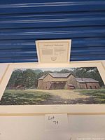 Full view of unframed print on table with COA displayed