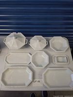 Top view of entire nine-piece porcelain serving set