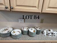Full set on countertop showing stacks of plates, bowls and cups