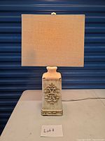 Front view of ceramic lamp with shade showing overall appearance