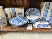 Liberty Blue covered bowl, gravy boat on underplate, butter dish, boxes labelled Liberty Blue, stoneware crock