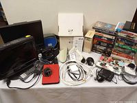 Overall view of monitors, cables, chargers, media stacks